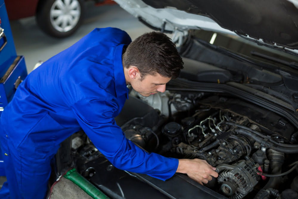 mechanic-servicing-car-engine
